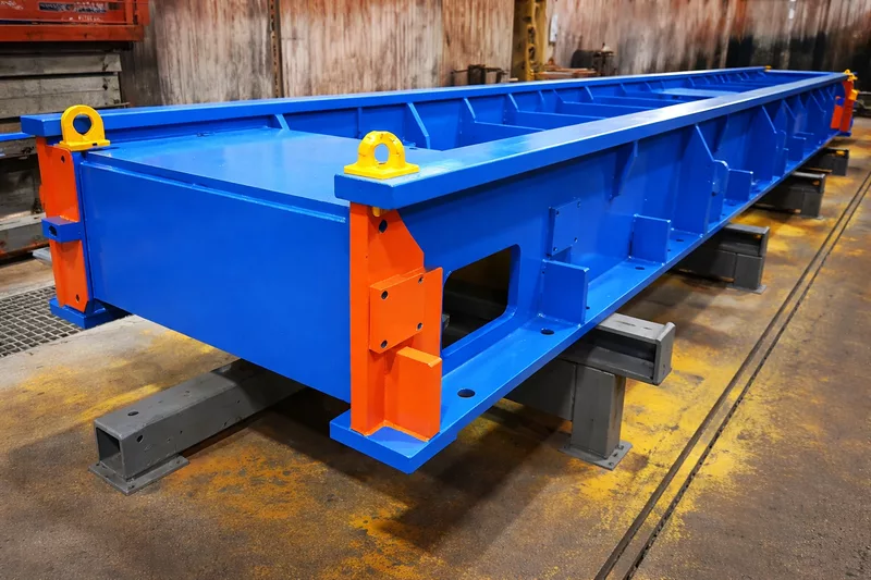 peinture-industrielle-metallurgie-bati-mecano-soude-couleur (1) Bâti mécano-soudé en acier peint en bleu et orange – application de peinture industrielle anticorrosion pour structure métallurgique